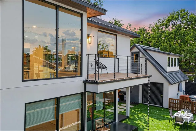 a view of a house with a backyard