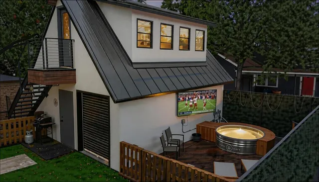 a balcony with table and chairs