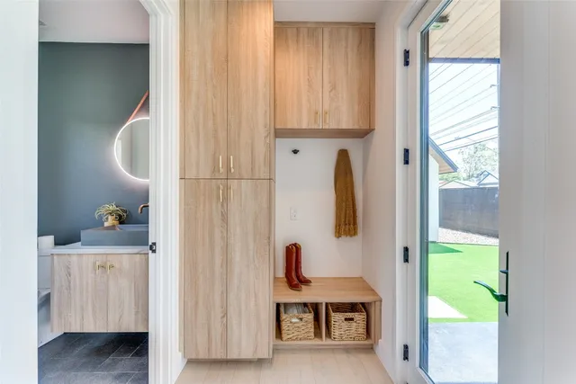a view of an empty room with glass door and balcony