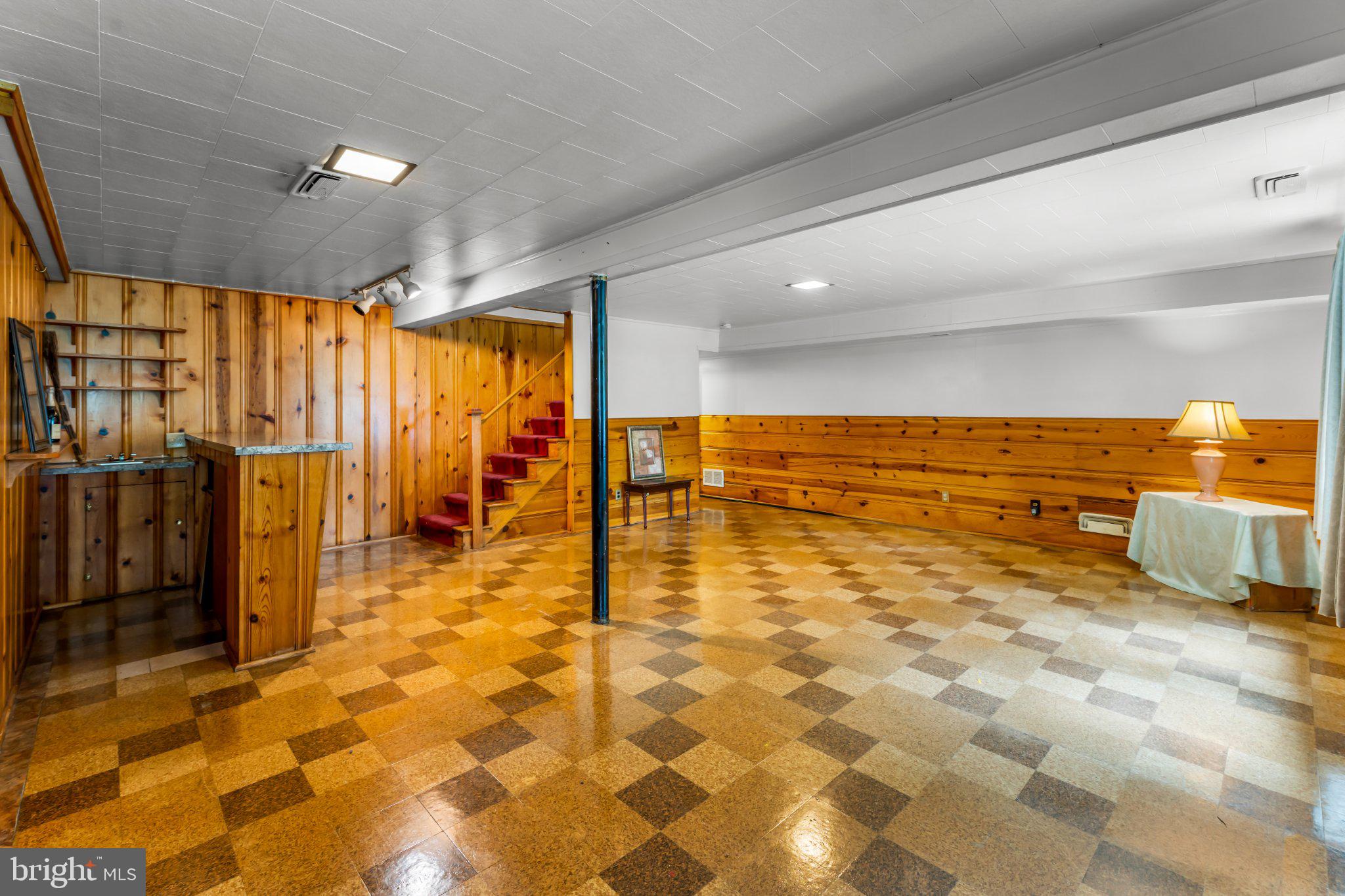 6723 Collinsdale Road Baltimore, MD 21234 - Photo 25 of 43 Spacious basement with warm wood accents.