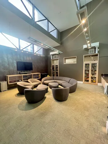 a view of the patio with couches chairs and potted plants