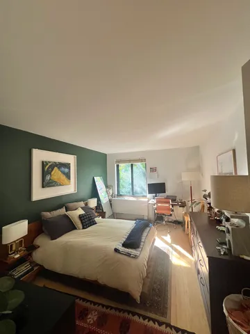 a bed room with bed and a couch