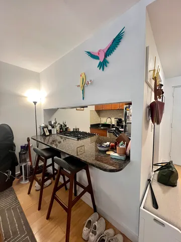 a room with furniture and a view of living room