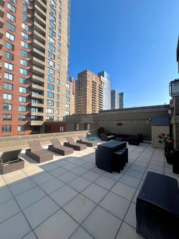 a view of terrace with seating space and barbeque oven