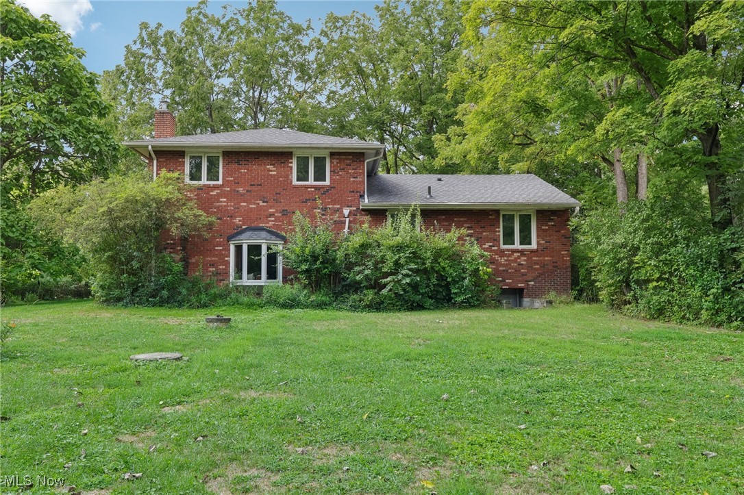 5845 Carsten Road Medina, OH 44256 - Photo 13 of 37 Rear view of property with a yard