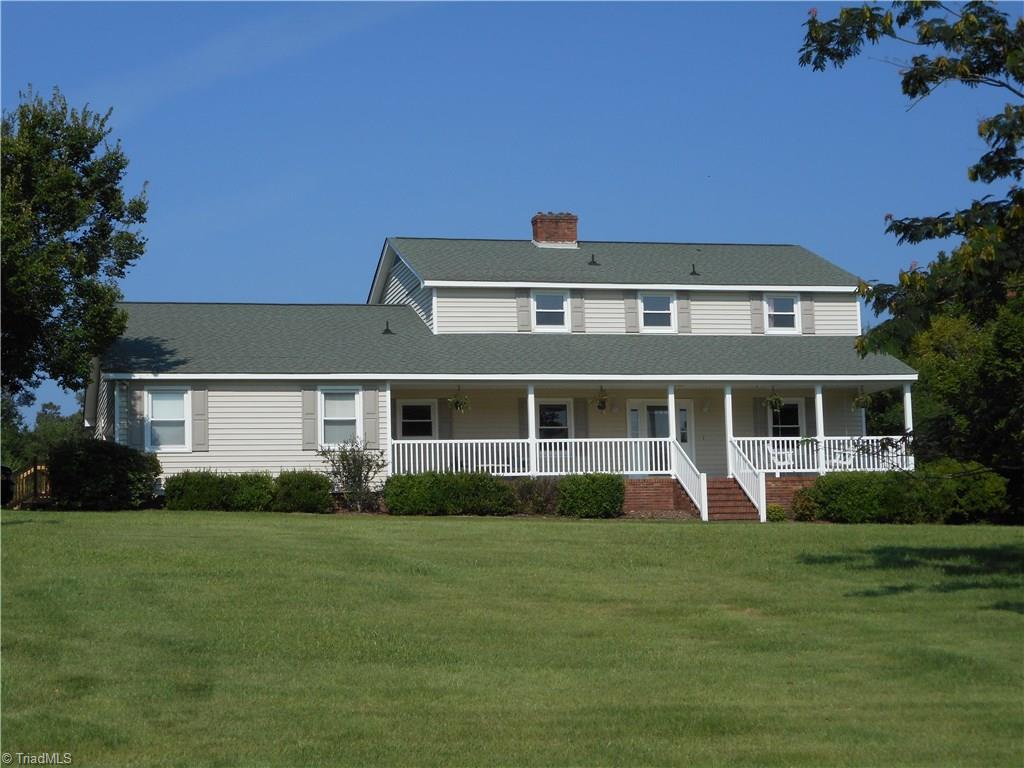6346 Company Mill Road Climax, NC 27233 - Photo 1 of 30 Location is important but you still have to love it to make it a home & you will love this one. As you look at these photos, picture & feel how nice it will be living here, calling this Your Home. It feels like HOME when you can see your furniture in every room. Here in this front view we can see the awesome front porch, the nice green grass, mature landscaping, trees, & the front entry. Is that you out there on the front porch checking out that big front yard. Notice also how quiet it is out here.