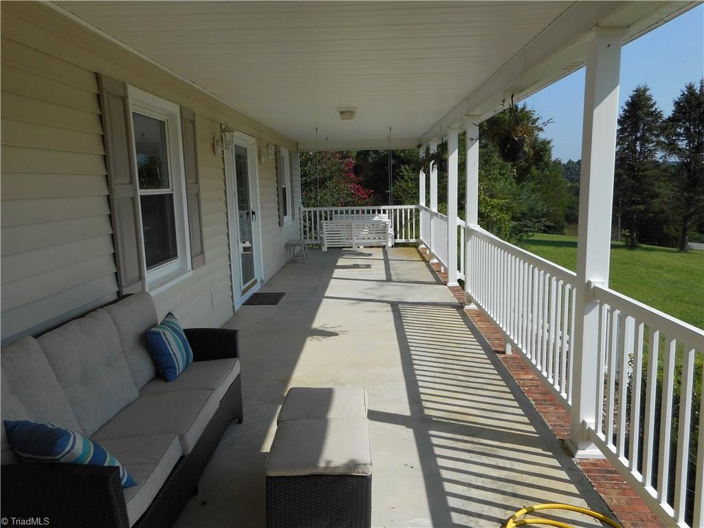 6346 Company Mill Road Climax, NC 27233 - Photo 10 of 30 Here it is and you know you really wanted to see a closer view of the front porch. Look at all that space, awesome for sure. Just picture yourself sitting out here looking out over your big front yard and thinking how very nice this all is.