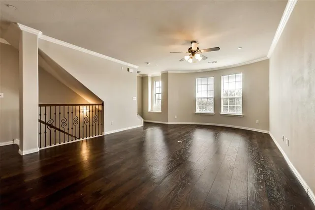 a view of kitchen and hall with wooden floor