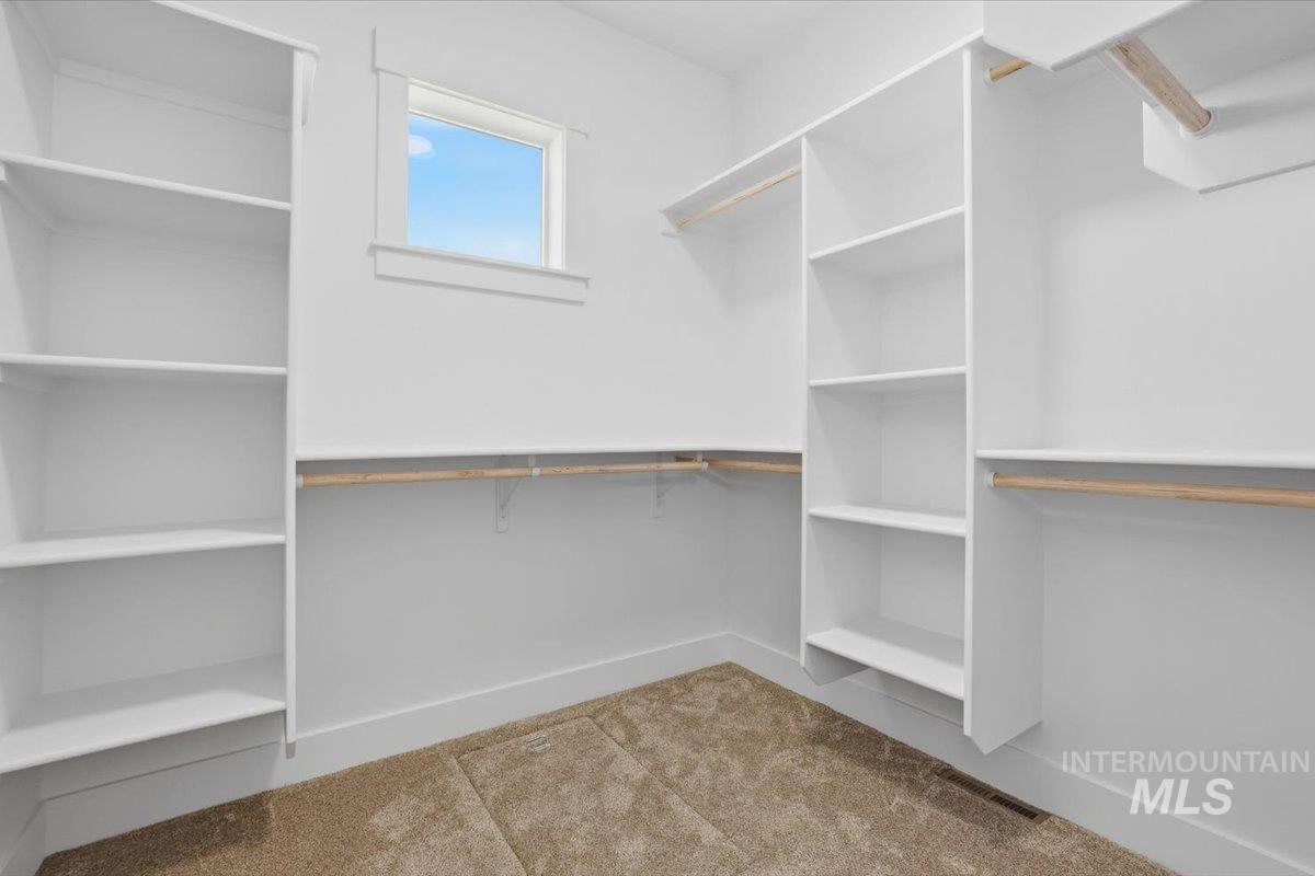 2175 Austin Way Fruitland, ID 83619 - Photo 25 of 30 Walk in closet featuring light carpet