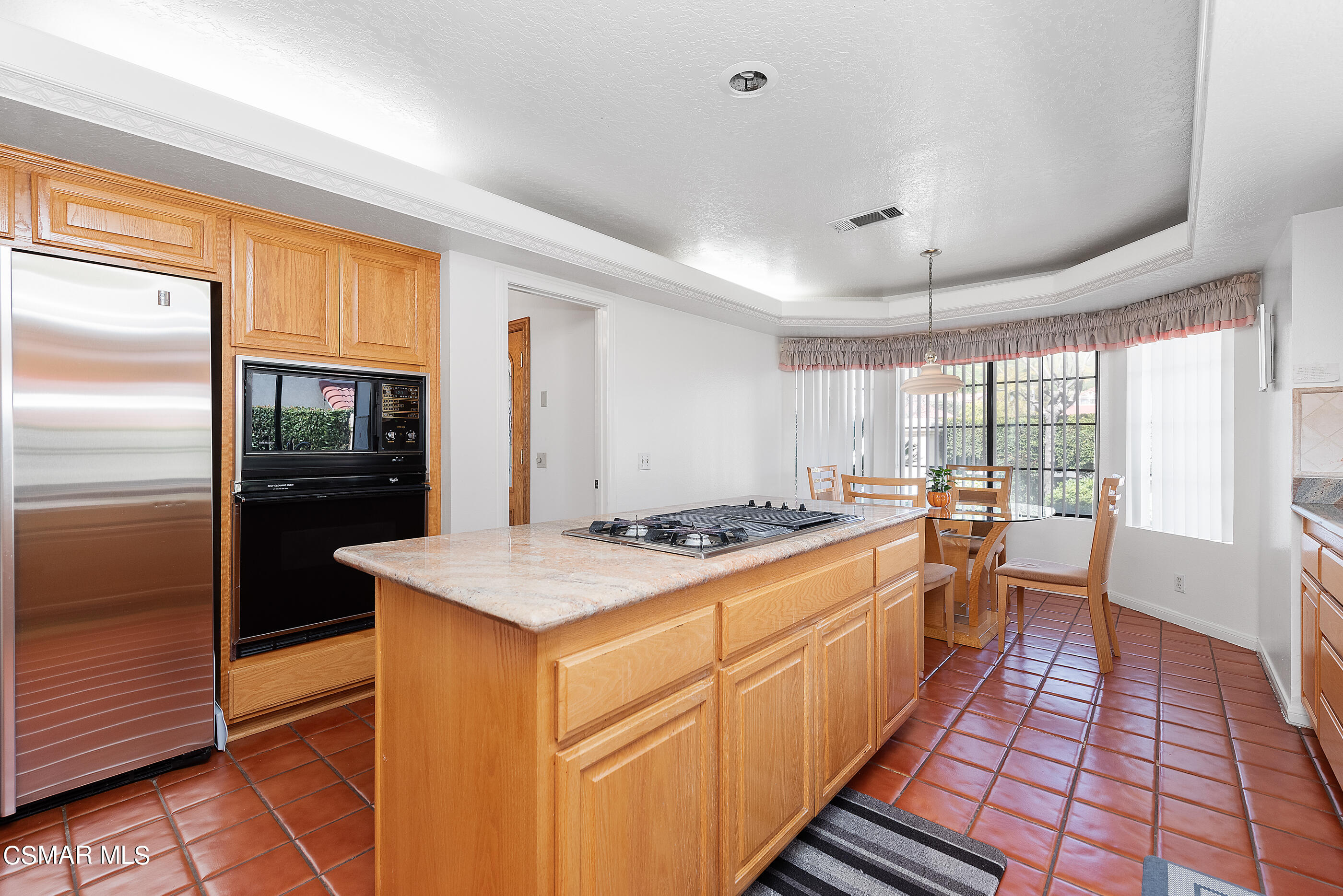 Undisclosed Address Simi Valley, CA 93063 - Photo 15 of 69 a kitchen with stainless steel appliances granite countertop a stove and a refrigerator