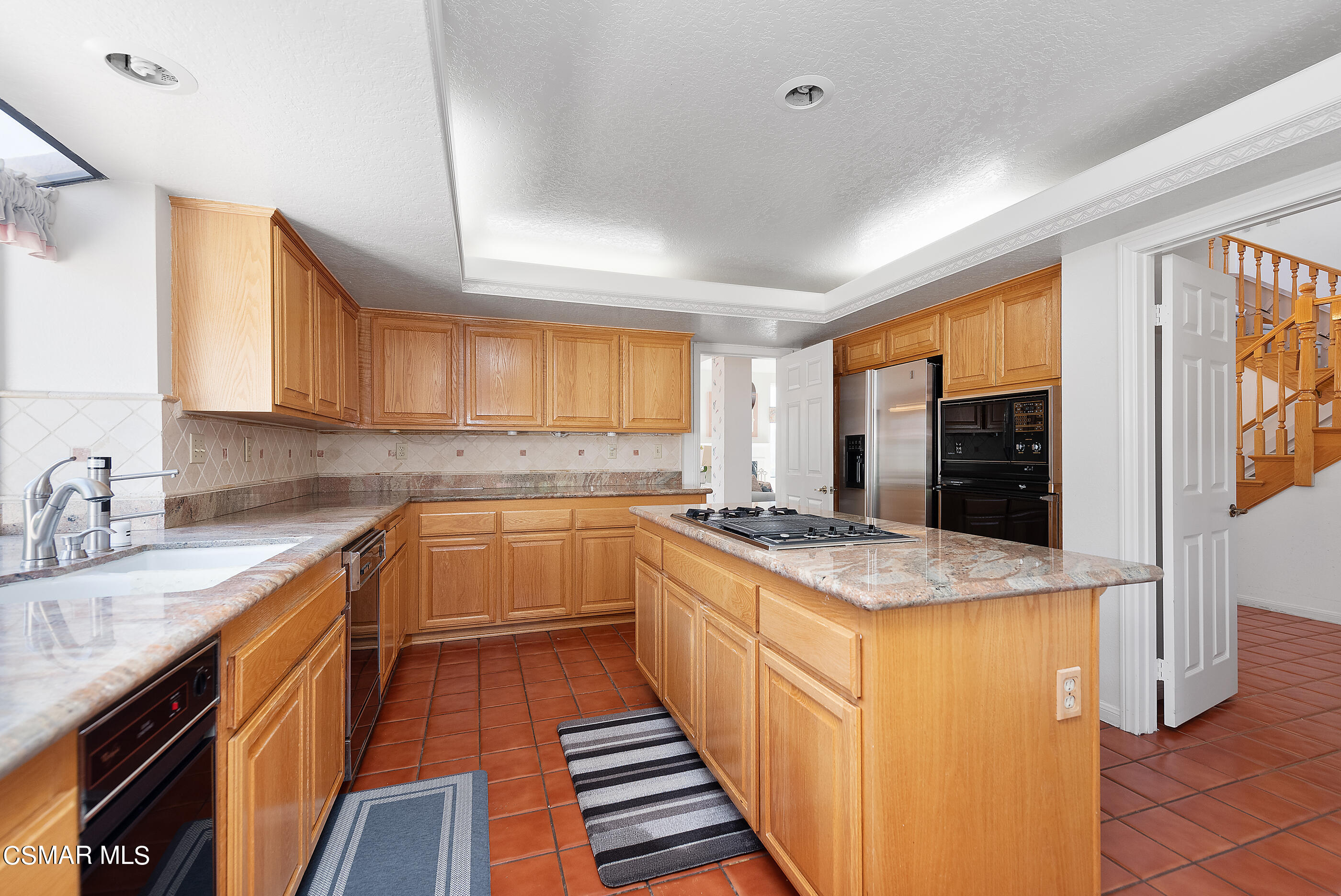 Undisclosed Address Simi Valley, CA 93063 - Photo 17 of 69 a kitchen with stainless steel appliances granite countertop a sink stove and refrigerator
