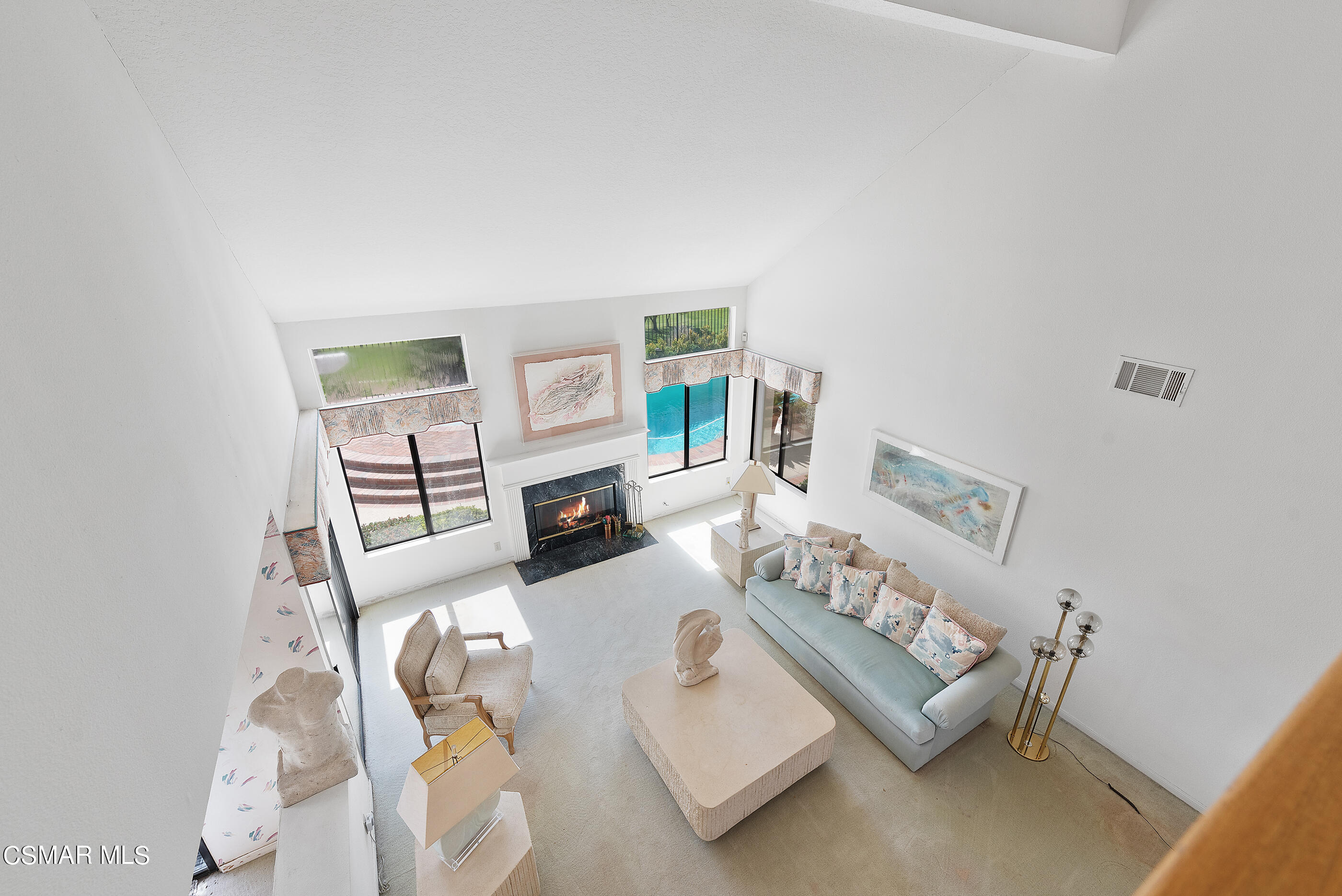 Undisclosed Address Simi Valley, CA 93063 - Photo 26 of 69 a living room with furniture a rug and a table