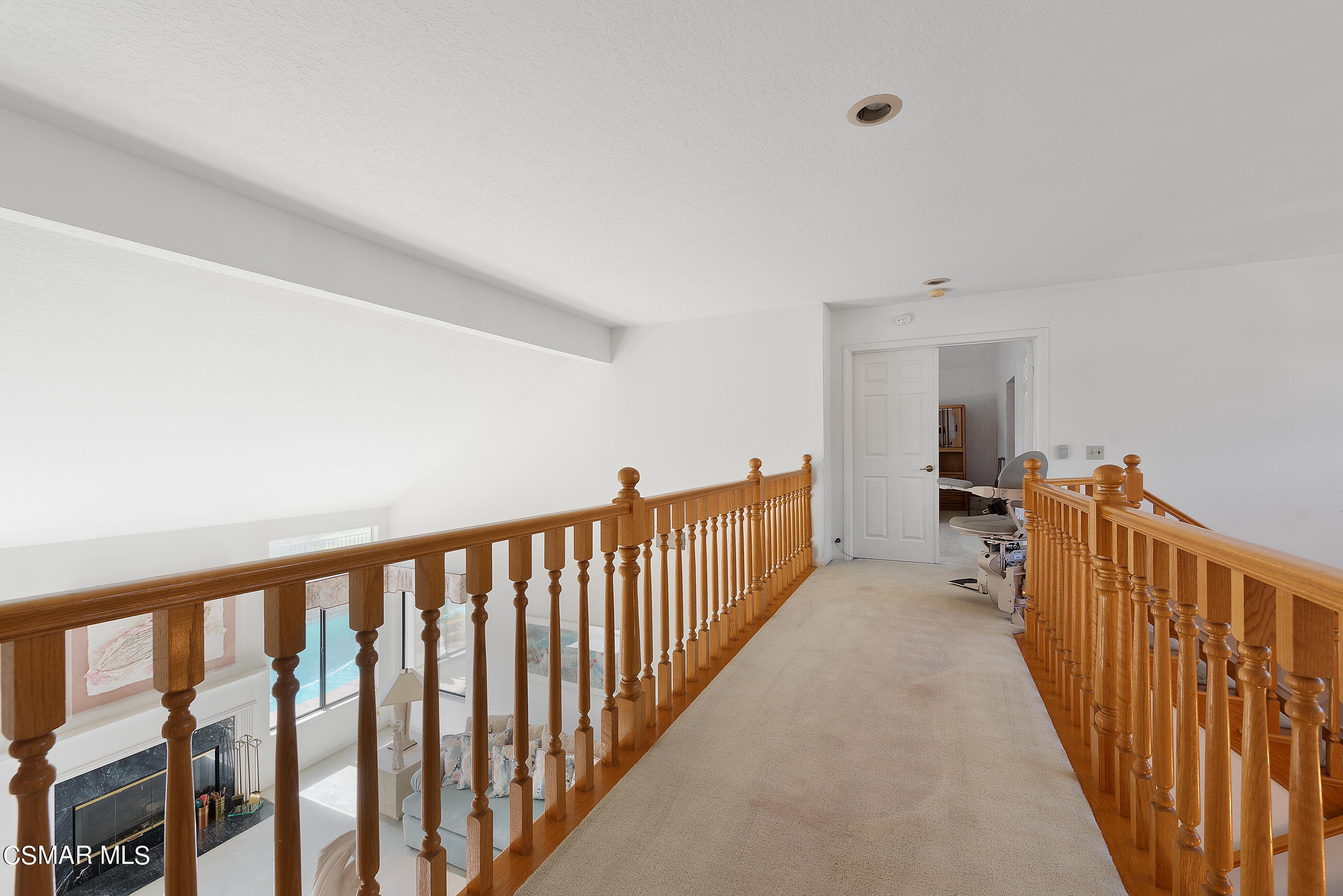 Undisclosed Address Simi Valley, CA 93063 - Photo 27 of 69 a view of a hallway with wooden floor and windows