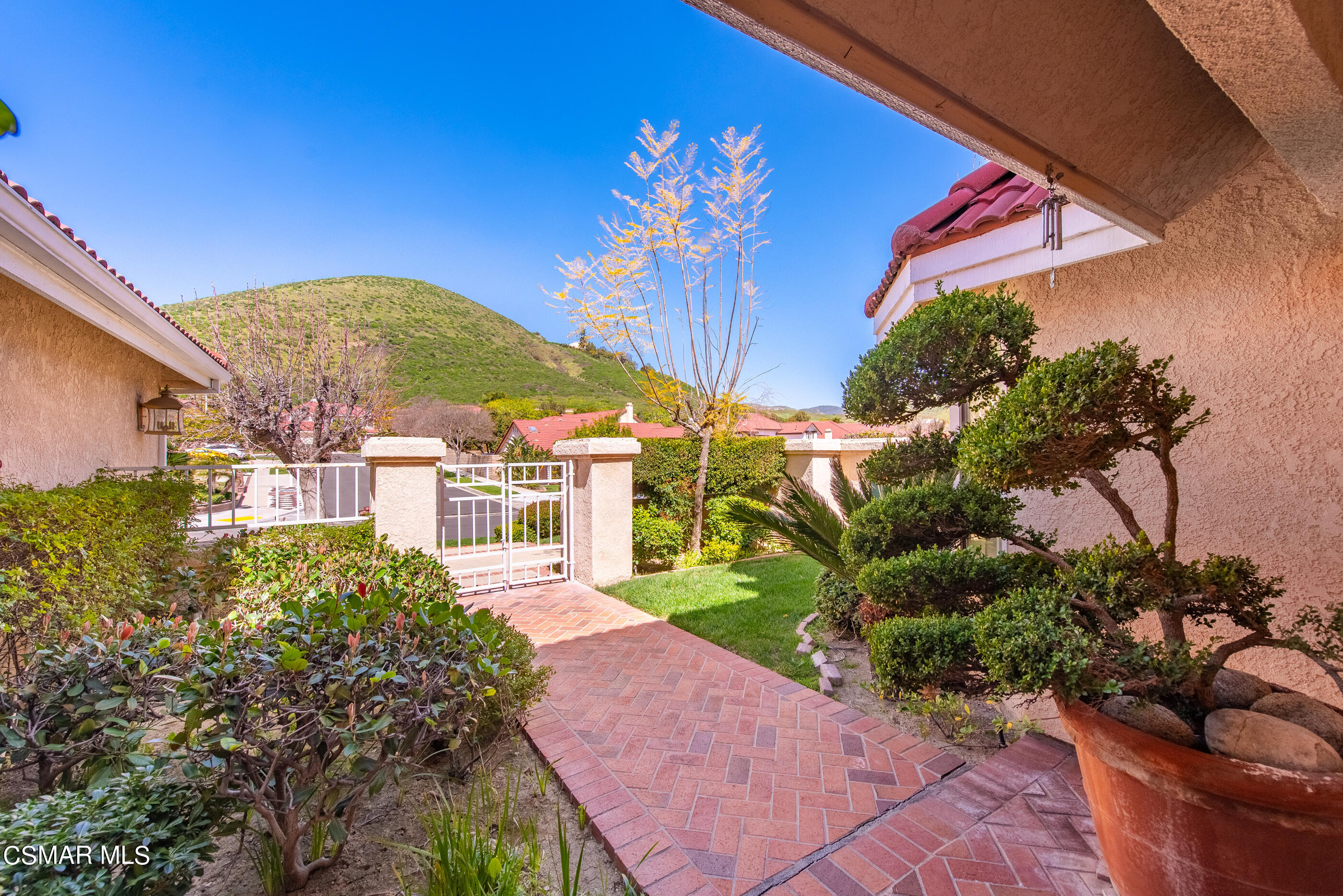 Undisclosed Address Simi Valley, CA 93063 - Photo 4 of 69 a front view of a house with a yard