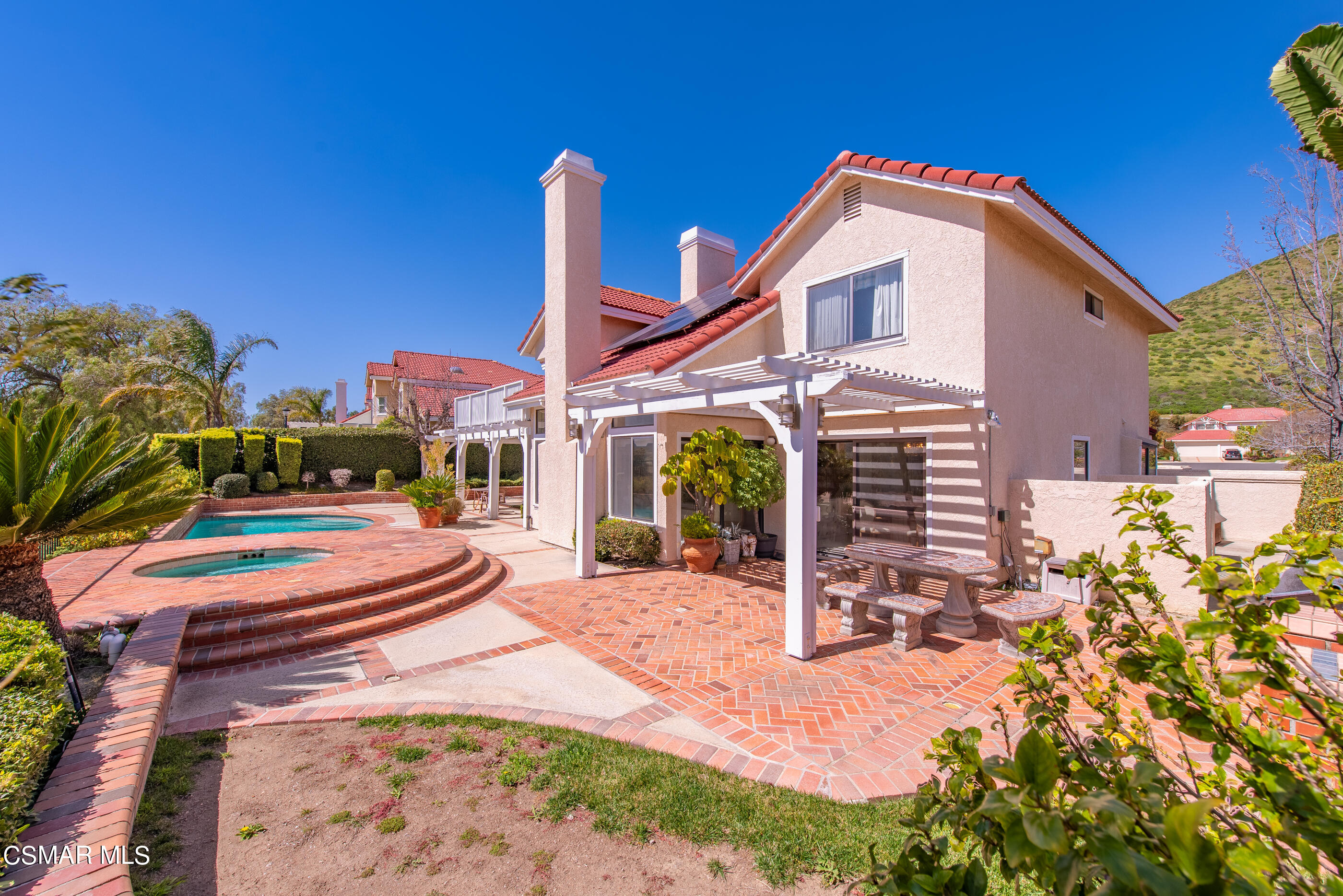 Undisclosed Address Simi Valley, CA 93063 - Photo 46 of 69 a backyard of a house with yard and outdoor seating
