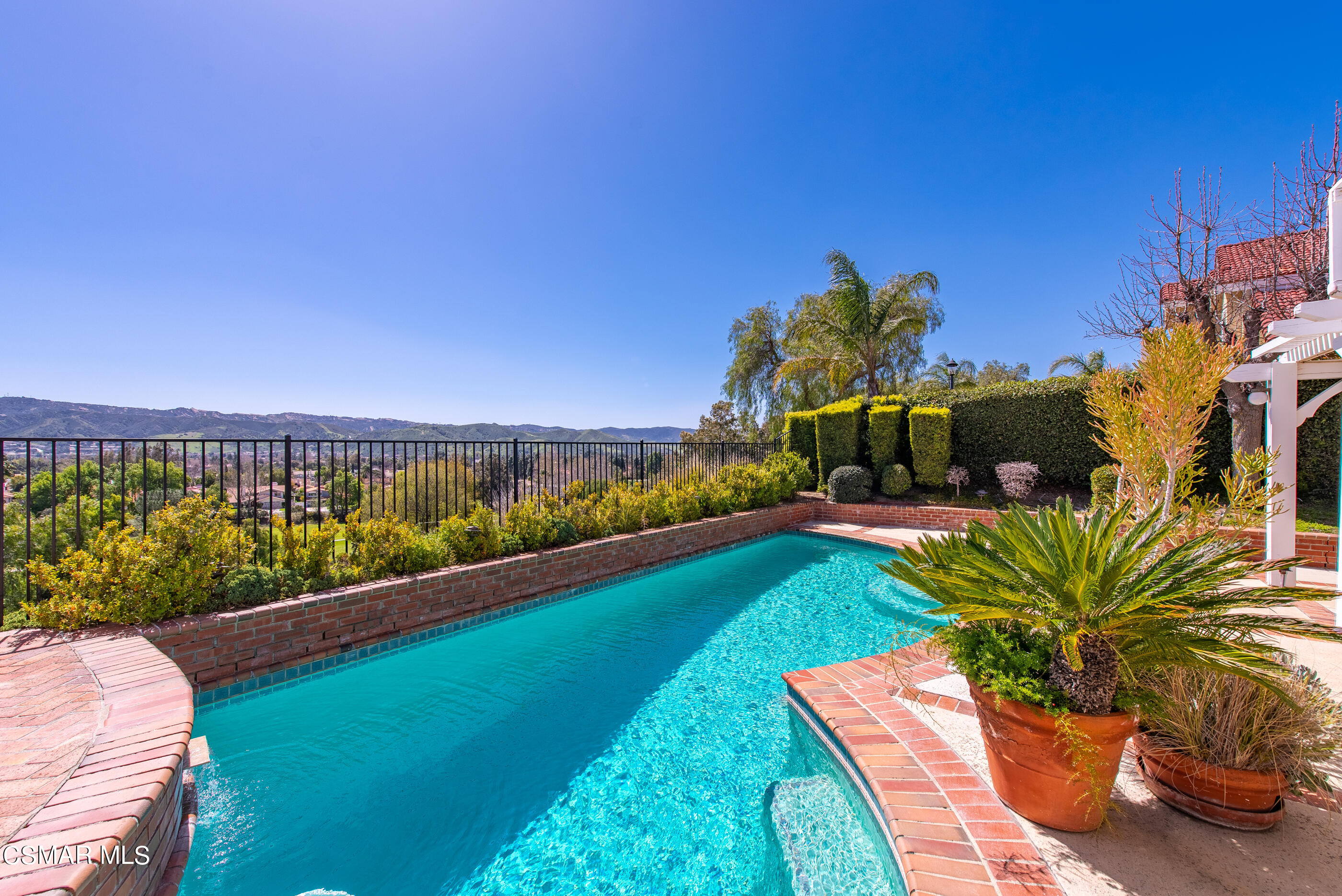 Undisclosed Address Simi Valley, CA 93063 - Photo 51 of 69 a view of swimming pool with a yard and potted plants
