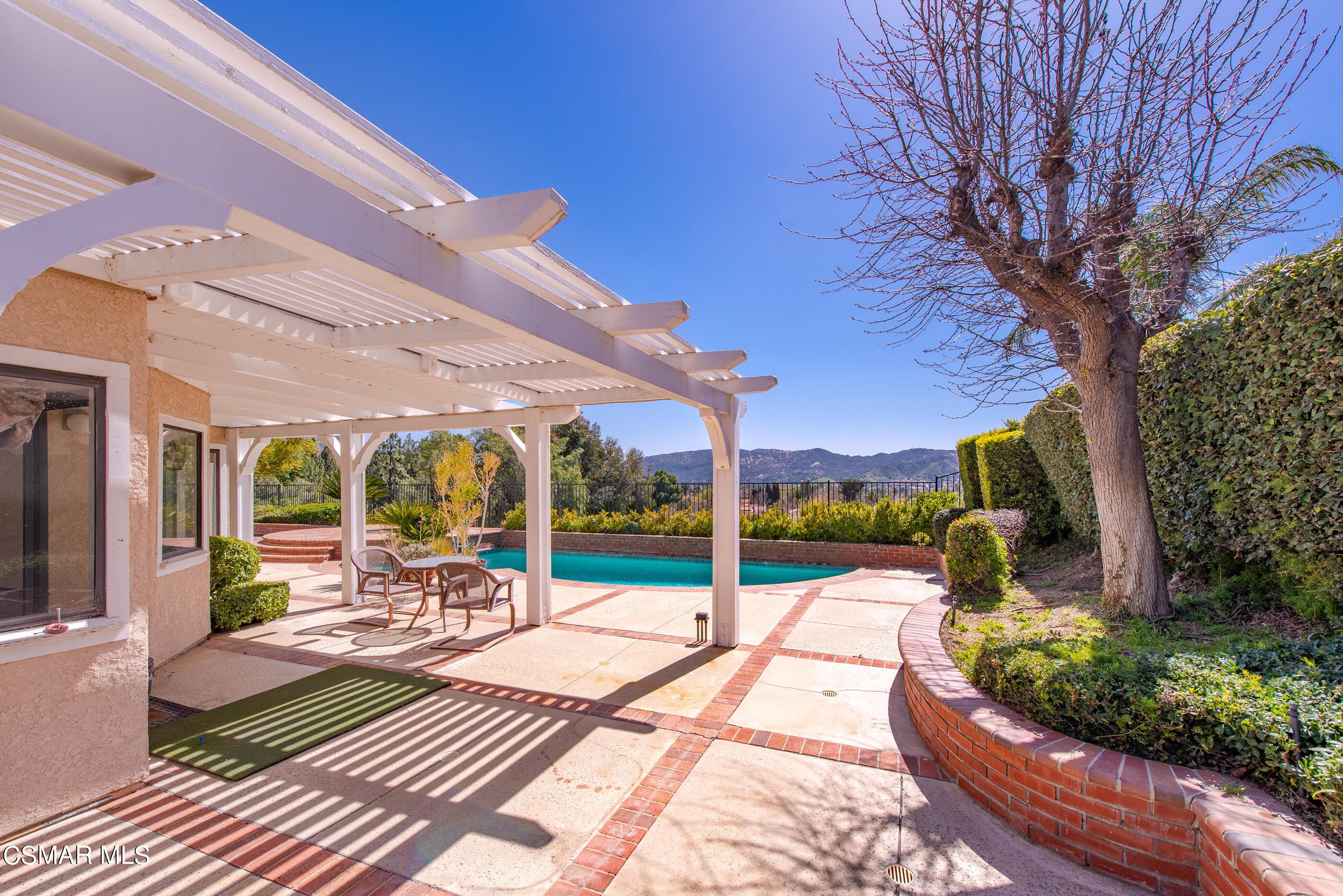 Undisclosed Address Simi Valley, CA 93063 - Photo 54 of 69 a view of a patio with a dining table and chairs