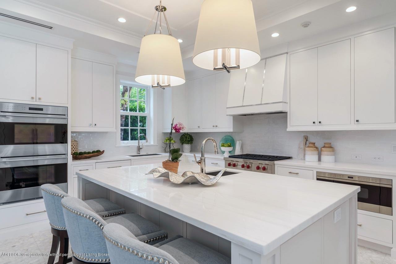 225 Arabian Road Palm Beach, FL 33480 - Photo 6 of 14 a kitchen with a white cabinets and white appliances