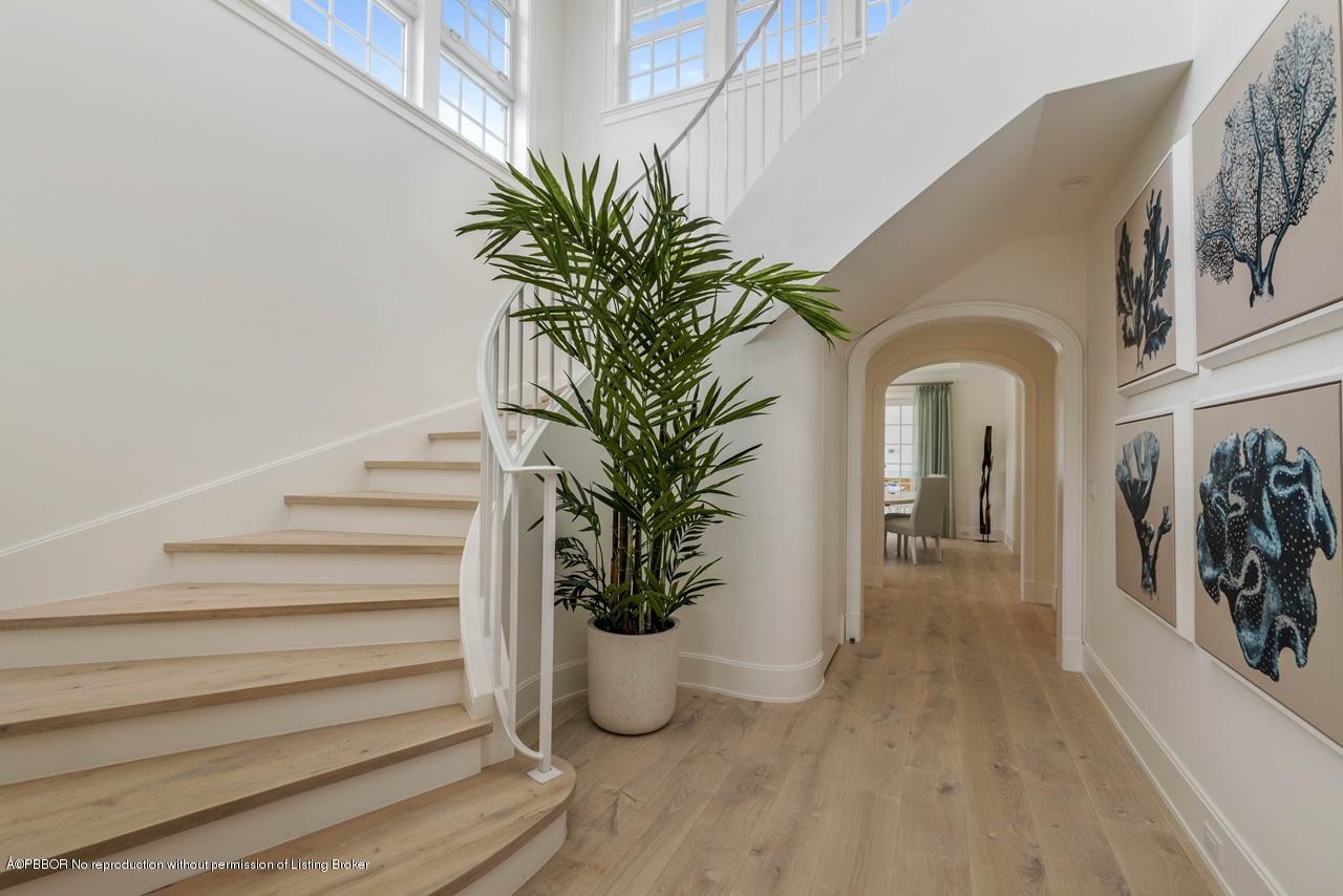 225 Arabian Road Palm Beach, FL 33480 - Photo 7 of 14 a vase of flowers sitting on a floor