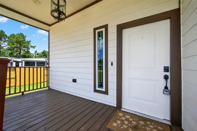 a view of a balcony with wooden floor