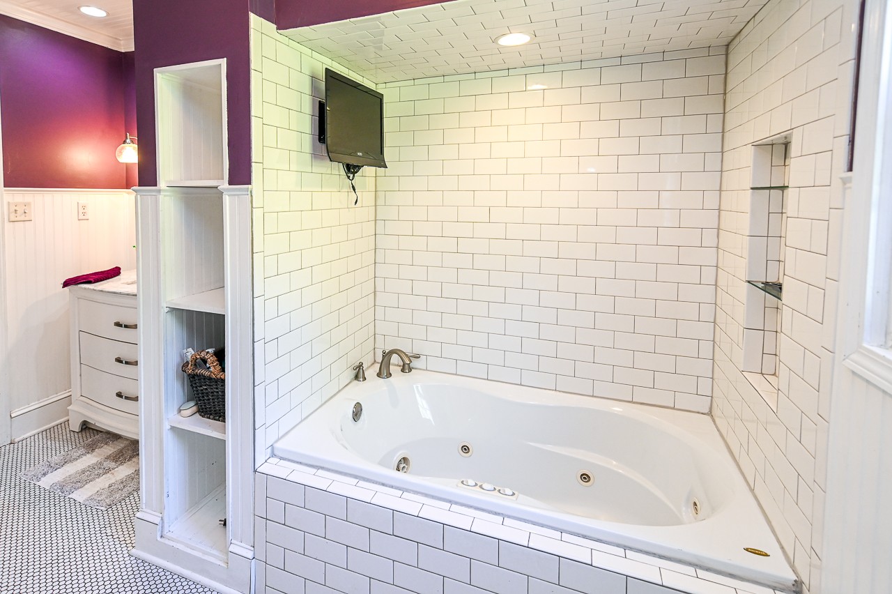 183 Lane Branch Road Fayetteville, TN 37334 - Photo 23 of 48 a bathroom with a bathtub and a shower