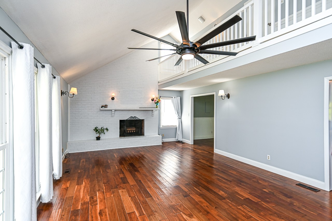 183 Lane Branch Road Fayetteville, TN 37334 - Photo 26 of 48 a view of a livingroom with wooden floor and a fireplace