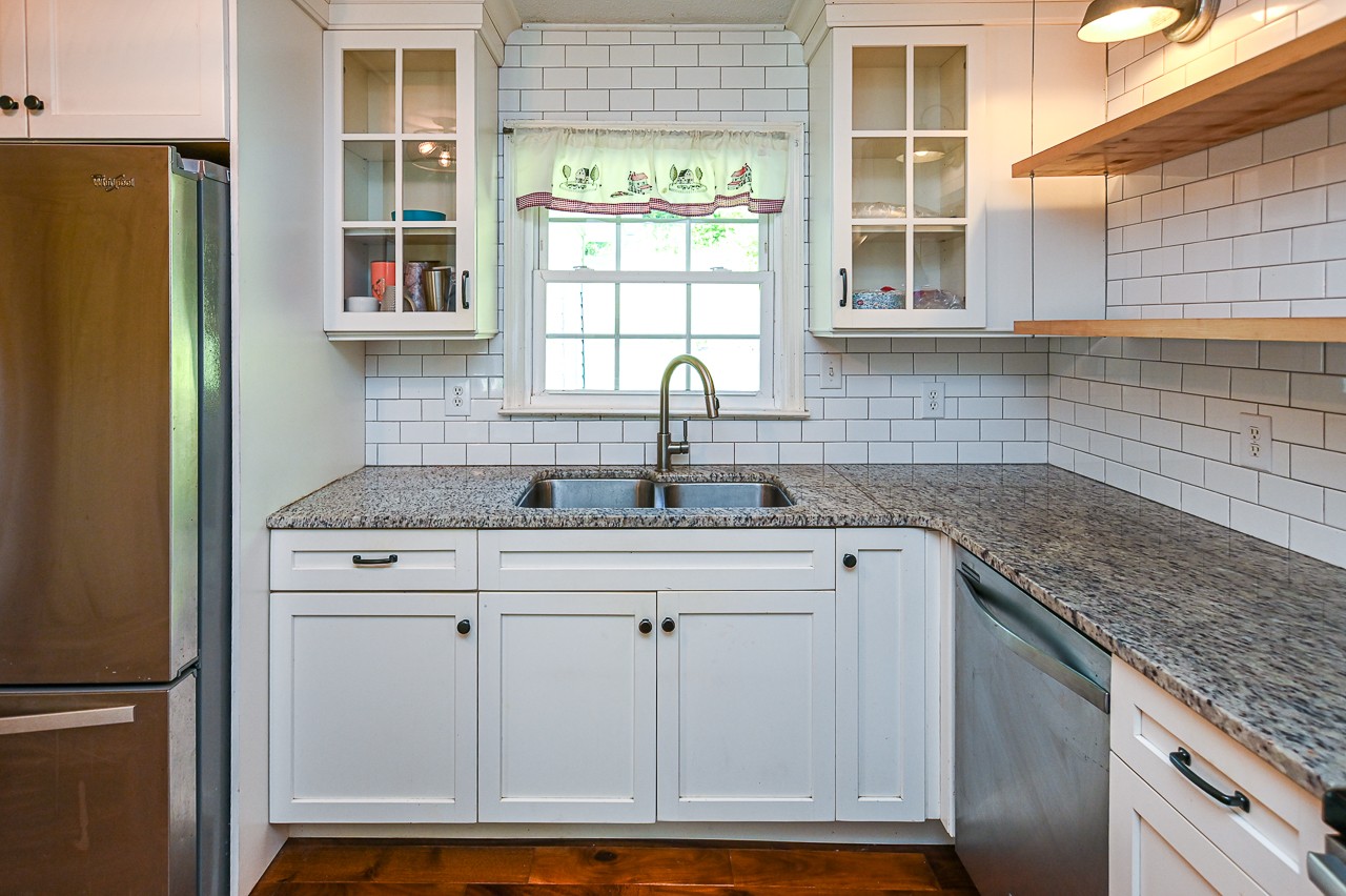 183 Lane Branch Road Fayetteville, TN 37334 - Photo 31 of 48 a kitchen with granite countertop a sink and a window