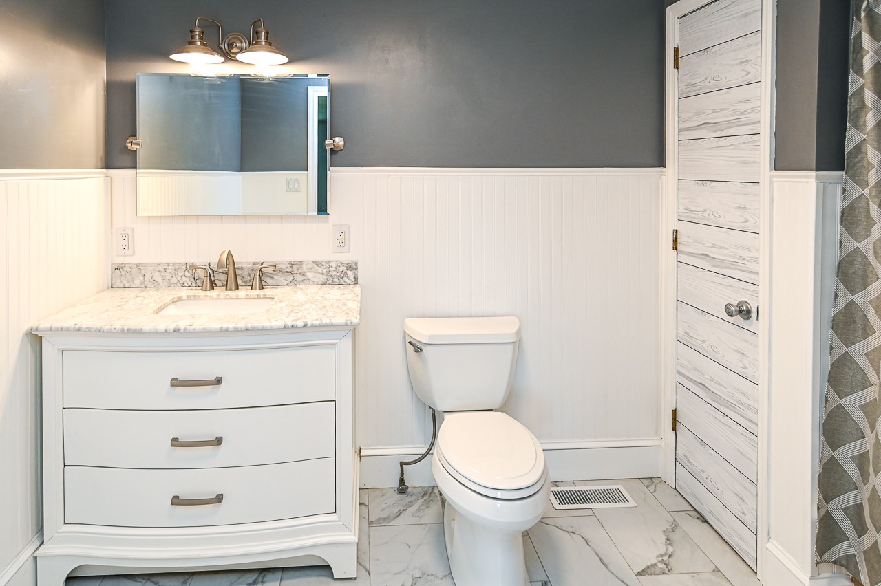 183 Lane Branch Road Fayetteville, TN 37334 - Photo 35 of 48 a bathroom with a sink vanity mirror and toilet
