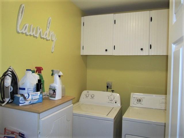 625 Coop Road Bell Buckle, TN 37020 - Photo 14 of 27 Nice, large utility room with wall mounted storage cabinets. Washer and dryer remain with the house