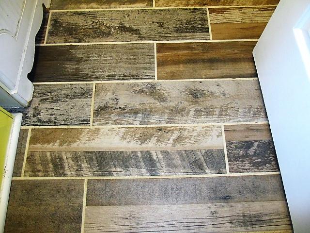 625 Coop Road Bell Buckle, TN 37020 - Photo 15 of 27 This beautiful, wood-look porcelain tile is featured in the utility room and the bathroom