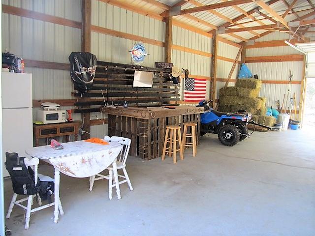 625 Coop Road Bell Buckle, TN 37020 - Photo 20 of 27 The entertainment area, with a rustic, hand-crafted bar.