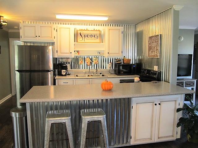 625 Coop Road Bell Buckle, TN 37020 - Photo 8 of 27 The kitchen is very thoughtfully decorated and features new appliances. Black stainless refrigerator