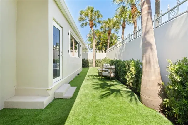 a view of yard from a tub