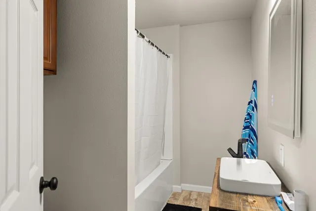 a room that has a rug and a window