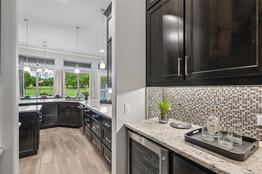 1657 Florence Road Keller, TX 76262 - Photo 13 of 40 a kitchen with a sink and a stove next to a window