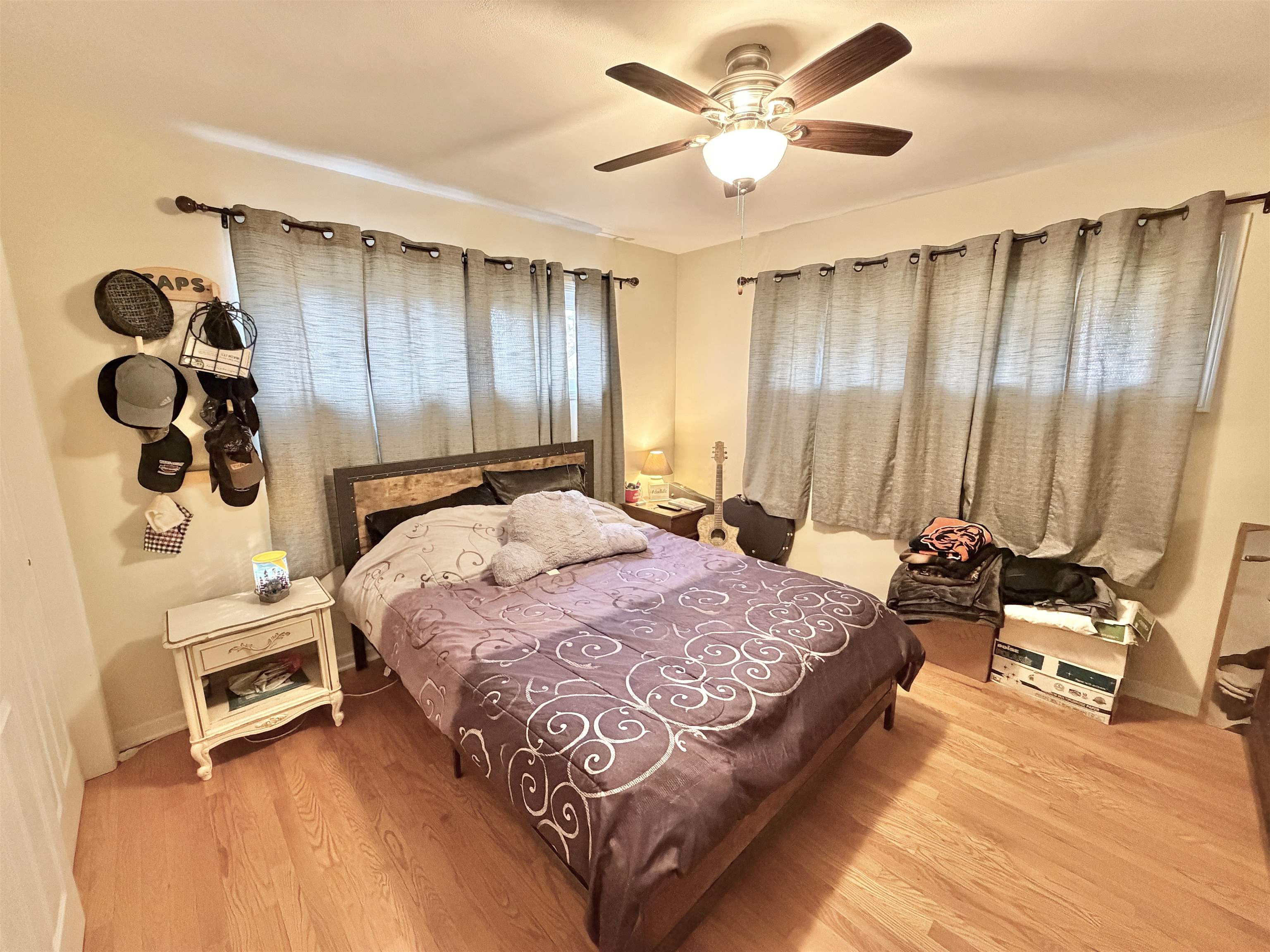 322 East 10th Street Pecatonica, IL 61063 - Photo 12 of 21 a bedroom with a bed and a chandelier