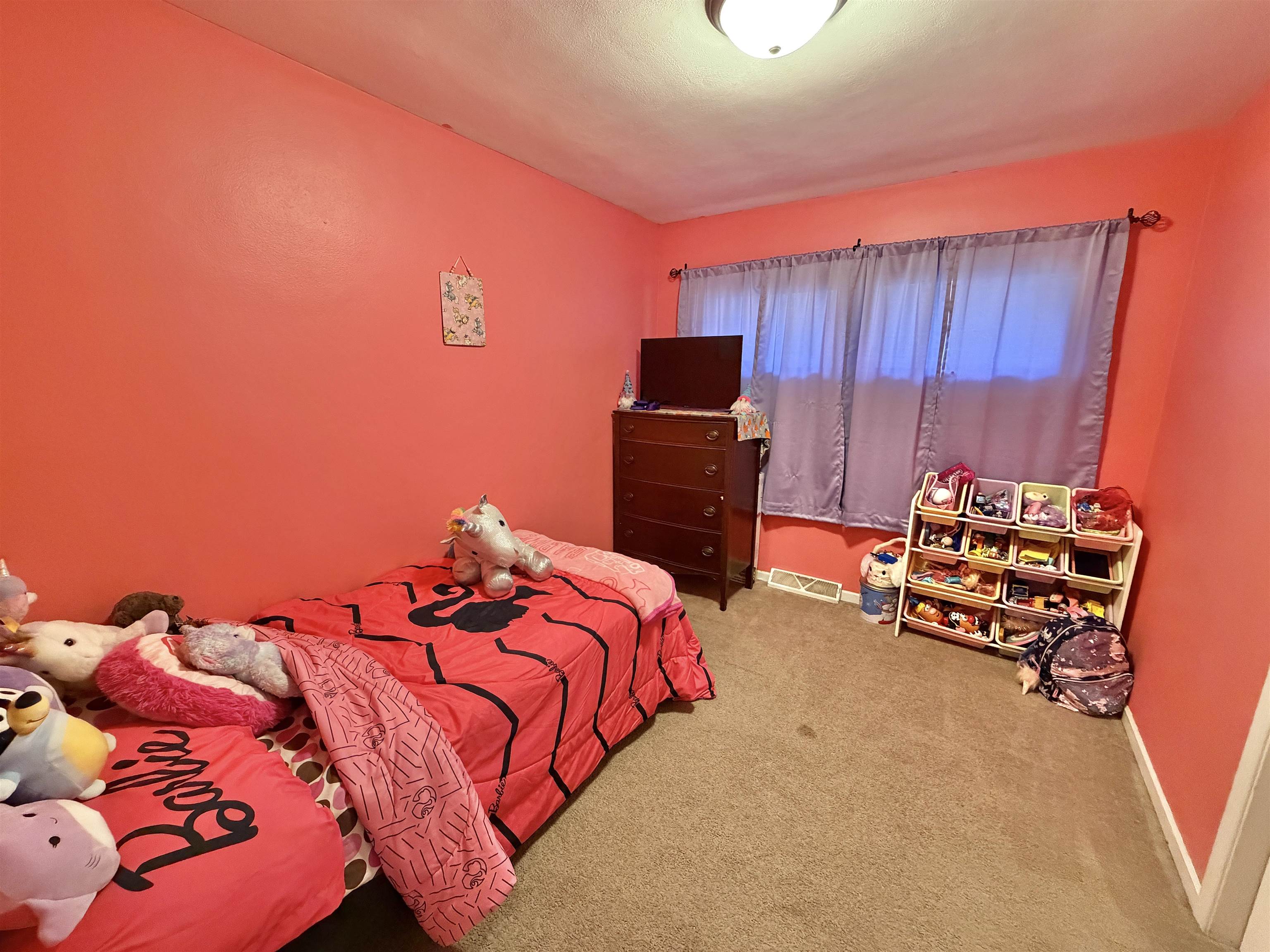 322 East 10th Street Pecatonica, IL 61063 - Photo 15 of 21 a bedroom with a bed and a television