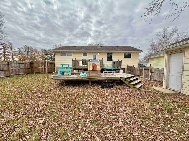 a view of a lake with couches and city view
