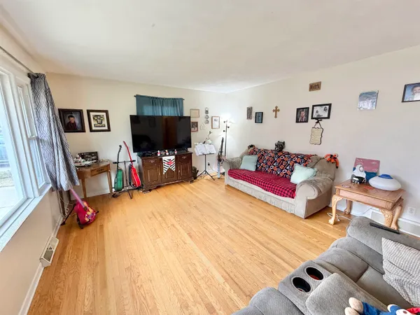 a living room with furniture and a large window