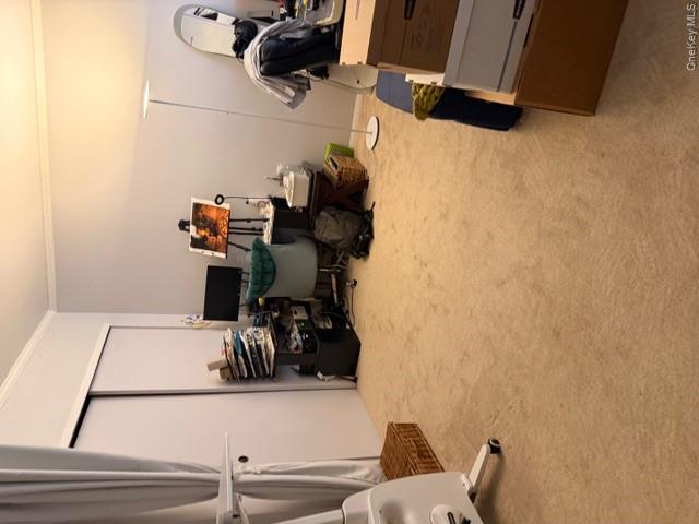 425 Shore Road, Unit 3A Long Beach, NY 11561 - Photo 17 of 17 a room with gym equipment and a view of living room