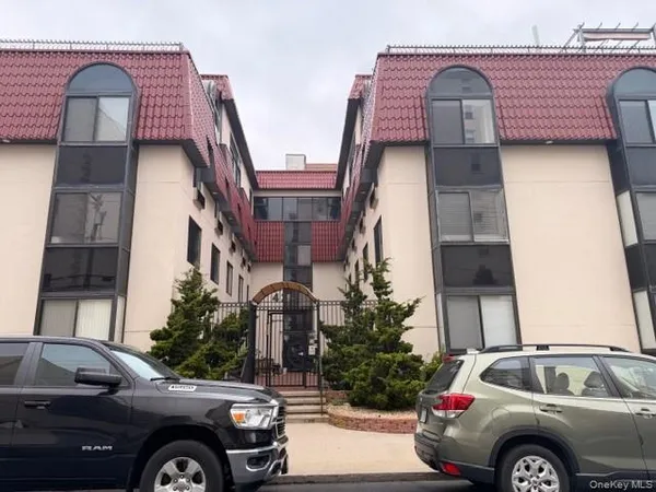 a view of a car parked in front of a house