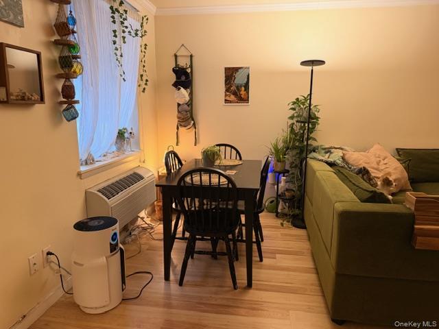 425 Shore Road, Unit 3A Long Beach, NY 11561 - Photo 4 of 17 a view of a dining room with furniture and wooden floor