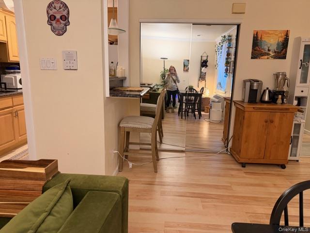 425 Shore Road, Unit 3A Long Beach, NY 11561 - Photo 5 of 17 a living room with furniture and wooden floor