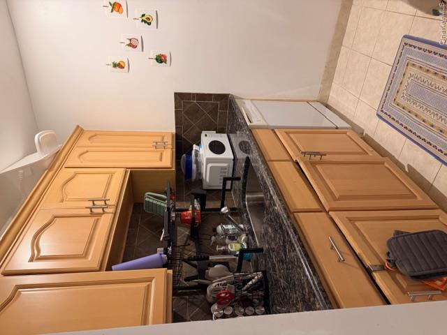 425 Shore Road, Unit 3A Long Beach, NY 11561 - Photo 8 of 17 a kitchen with stainless steel appliances granite countertop a sink stove and microwave