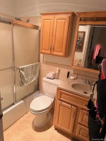 a bathroom with a toilet a sink and bathtub