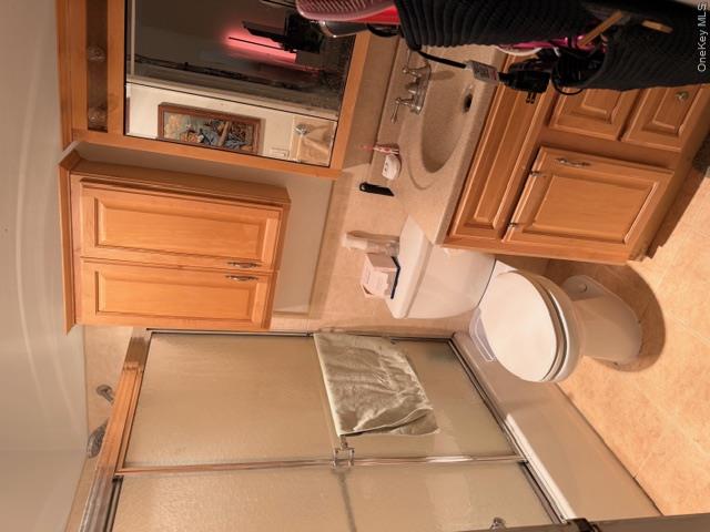 425 Shore Road, Unit 3A Long Beach, NY 11561 - Photo 10 of 17 a bathroom with a toilet a sink and bathtub