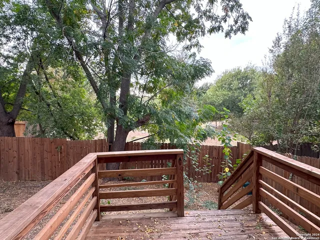 a view of deck and trees