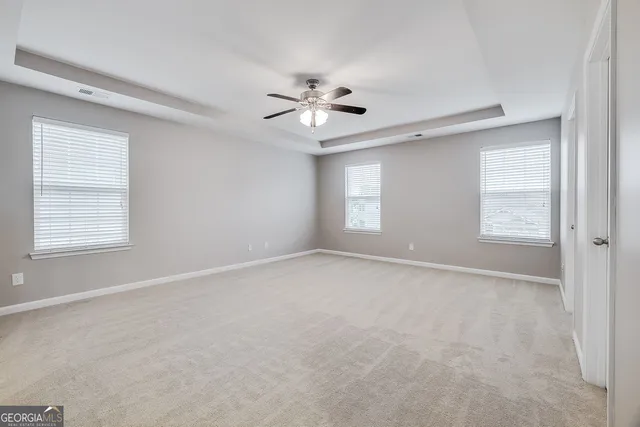 a white bath tub sitting next to a window