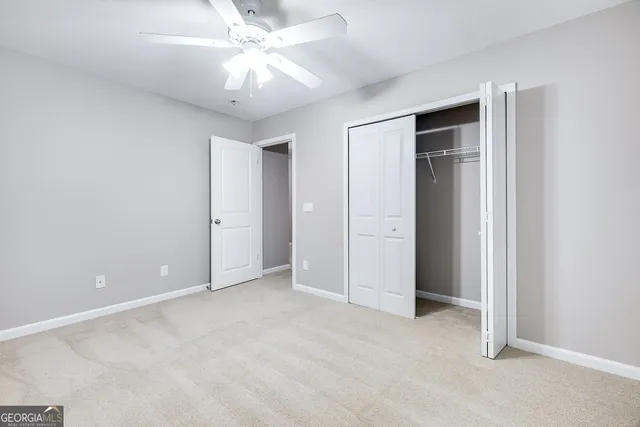 a view of an empty room with windows