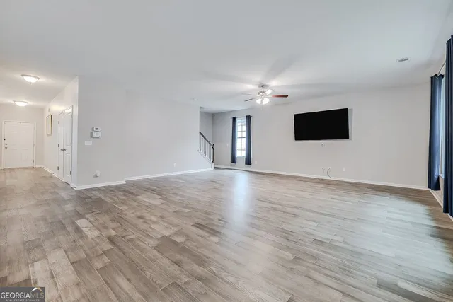 a view of a livingroom with wooden floor